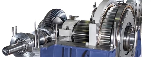 How does the load distribution affect the gear tooth contact pattern in a gearbox?